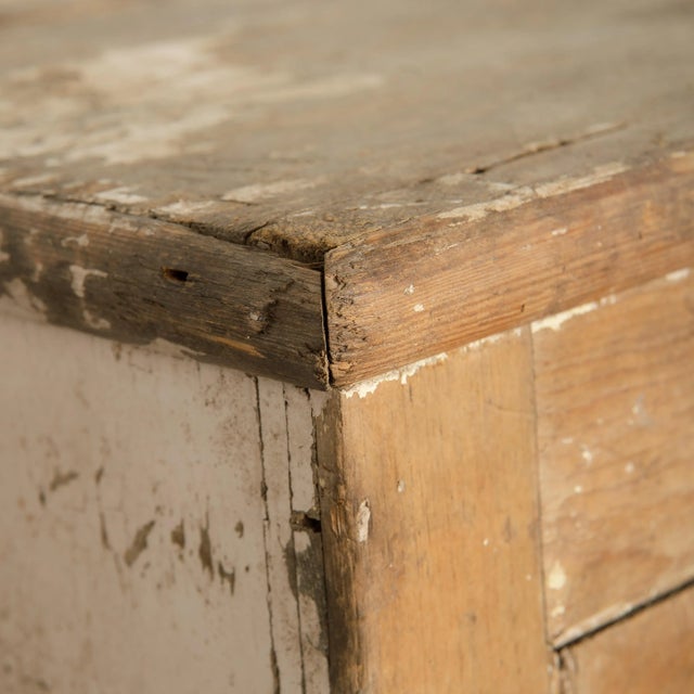 Vintage European cupboard with a knob handle and shelving.