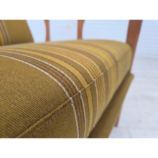 1970s, Danish armchair. Furniture wool, solid oak wood, springs in the cushions. Original good condition: no smells, no...