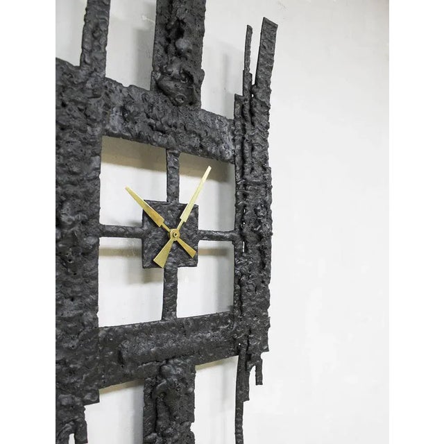 Unique this xl abstract vintage brutalist clock from the 60s. The clock is made from heavy cast iron with gold colored...