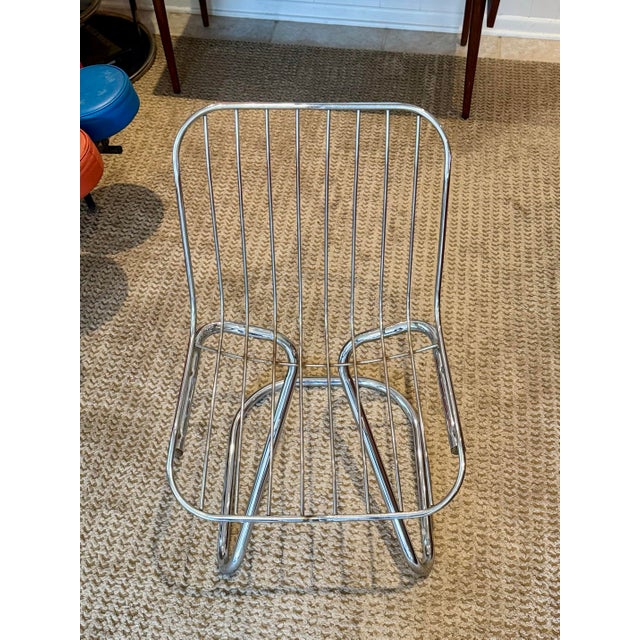 A space age Italian chair in the style of Gastone Rinaldi, circa 1970s. Featuring a sculptural chrome frame and...