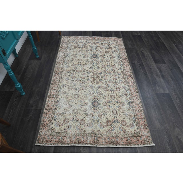 Vintage Hand-Knotted area rug is a semi-antique vintage area rug. The '70s Eastern region of Anatolia's unique rug is...