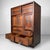 Characterful Japanese tansu cabinet in warm, beautifully aged wood, with striking dark, flame-like grain in the panels....