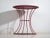 This antique table in painted metal is a European industrial piece, originally conceived as a functional auxiliary or...