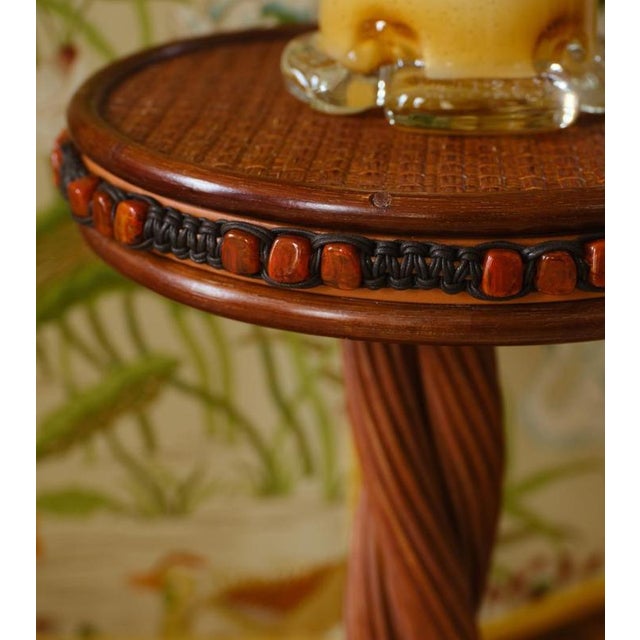 Romy side table in stained rattan, resin and leather by popus editions. Dimensions: ø 40 x h 56 cm. Materials: stained...