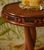 Romy side table in stained rattan, resin and leather by popus editions. Dimensions: ø 40 x h 56 cm. Materials: stained...
