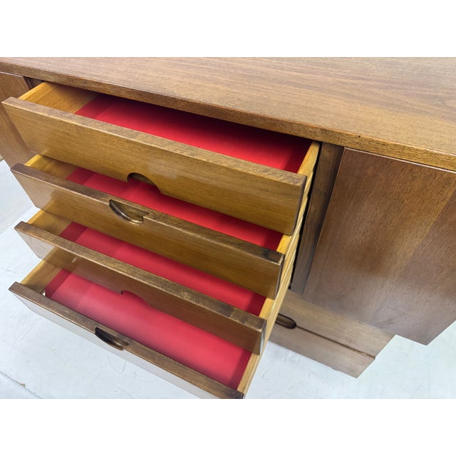 A sculptural and subtly architectural cabinet designed by Giovanni Michelucci for Poltronova in the 1950s. Crafted in warm...