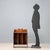 Small portable walnut bookcase. Curved upper balustrade, sides, and bracketed feet. Bronze side handles with mask motifs....