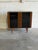This beautiful Bookcase features an open display Cabinet layout enclosed by two sleek smoked glass cabinet doors. The...