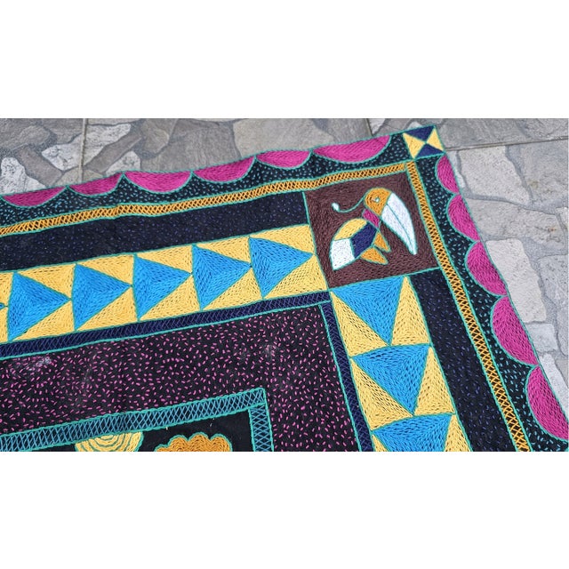 Embroidered kilim featuring South African parrots, from 1997. dimensions: height 77.5 cm, width 75 cm, depth 1 cm.