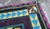 Embroidered kilim featuring South African parrots, from 1997. dimensions: height 77.5 cm, width 75 cm, depth 1 cm.