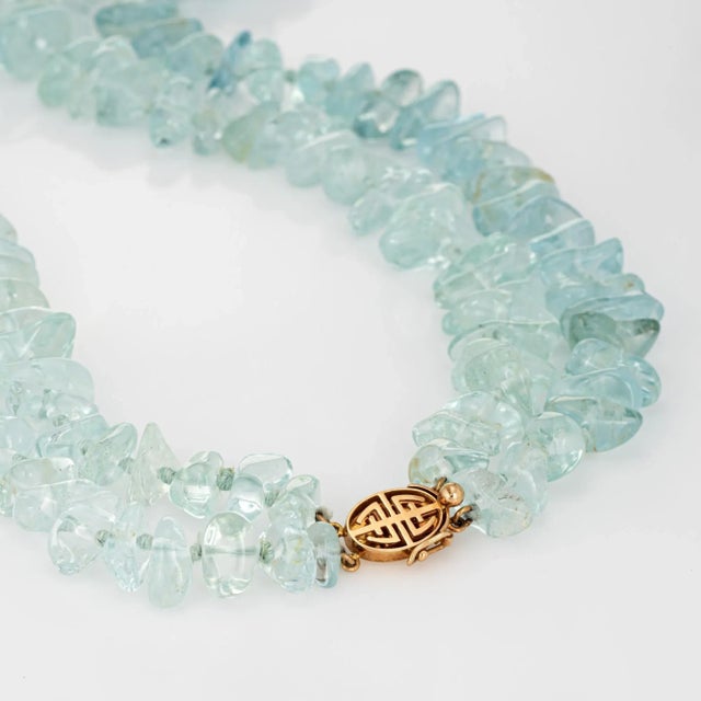 Finely detailed estate Gump''s double strand aquamarine necklace finished with a 14k yellow gold clasp. Tumbled aquamarine...