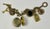 Antiqued gold-toned charm bracelet with a toggle clasp, six charms including a functional locket, a charm with the RL...
