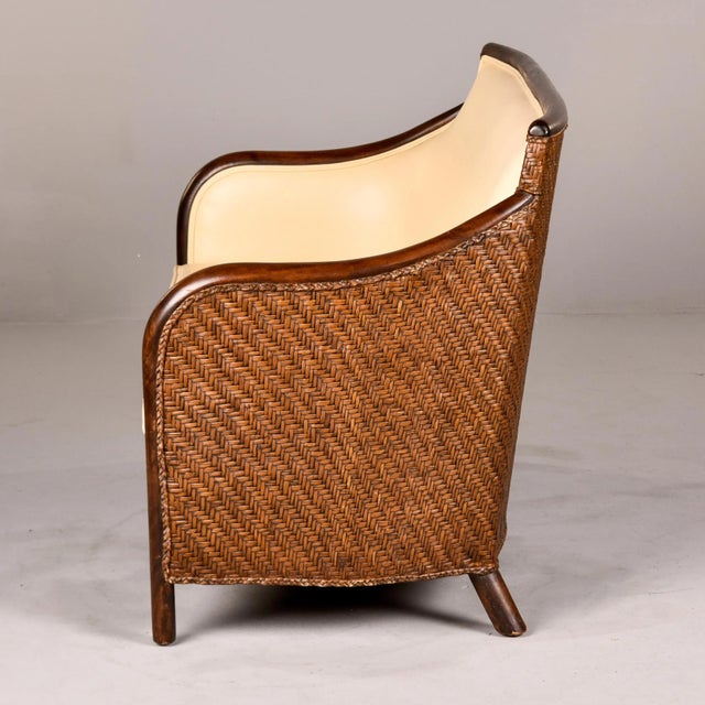 Found in Italy, this wicker and bentwood frame sofa dates from the 1940s. We had it reupholstered in a creamy, ivory...