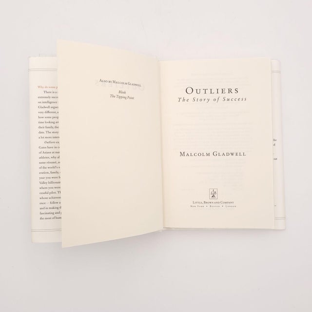 Malcolm Gladwell, "Outliers", published by Little, Brown & Co., first edition 2008. Dust jacket wrinkled and smudged.