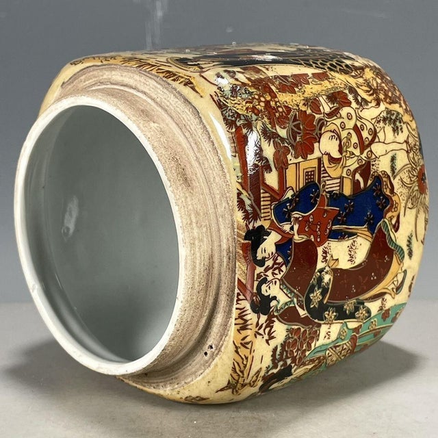 Add a touch of vibrant Eastern artistry to your home with this beautiful porcelain jar. Featuring a classic cylindrical...