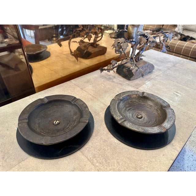This very heavy and aged ash tray for cigars or whatnot has a second iron base and is truly a classic French piece. NOTE:...