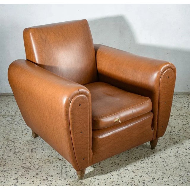 Brown leather armchair with the option of adding a separate footstool. Italy, 1970. Dimensions: 93.5 cm x h 78.5 cm x seat...