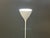 A mid century modern white floor lamp torchere designed by Ernst Luthiger for B.A.G. Turgi. Often misattributed to Max...