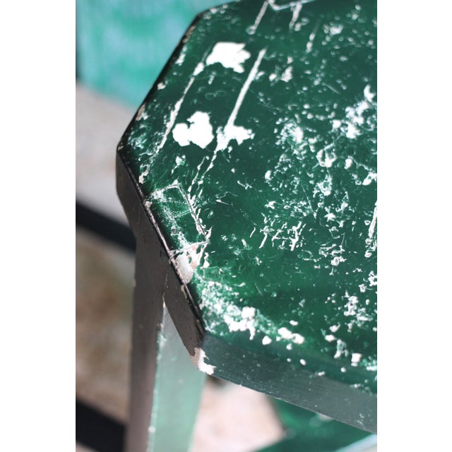 A unique shaped tall stool with an octagon seat and squared wood legs. Great rustic style with chippy green paint....