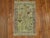 a Sweet Persian Pictorial mat in tan light blue and red accents Details rug no. r5046 size 1' 9" x 2' 9" (53 x 84 cm)