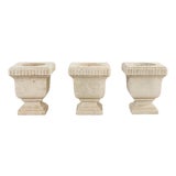 Set of Three Neoclassical Style Carved Stone Urn Planters For Sale