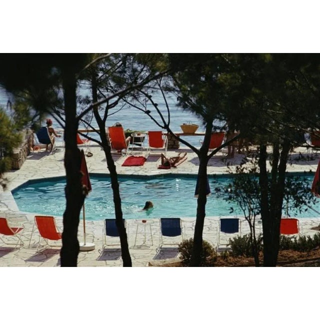 Hotel Il Pellicano 1973 by Slim Aarons Slim Aarons Limited Estate Edition The beachside pool at the Hotel Il Pellicano in...