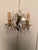 Pair of two-arm French wall sconces dating to circa 1890, crafted in bronze and crystal with elegant decorative detailing....