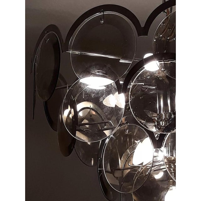 Smoked glass lamp object: hanging lamp 10 flames 10xe14 age: circa late 1970s color/material: chrome / smoked glass mass:...