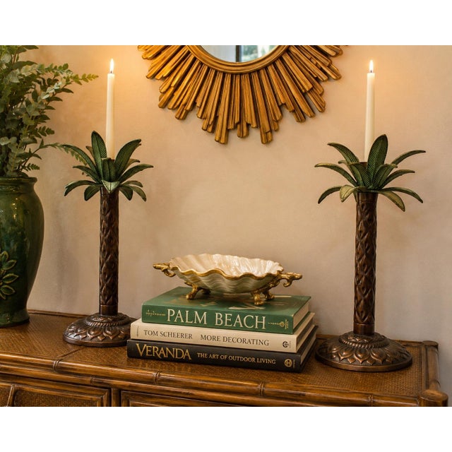 triking pair of vintage sculptural palm tree candle holders featuring tall textured trunks, dramatic layered palm fronds...