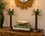 triking pair of vintage sculptural palm tree candle holders featuring tall textured trunks, dramatic layered palm fronds...