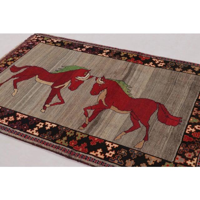 Hand-knotted in wool and originating circa 1950-1959 from Afghanistan, this 4x6 vintage Gabbeh rug joins Rug & Kilim’s...