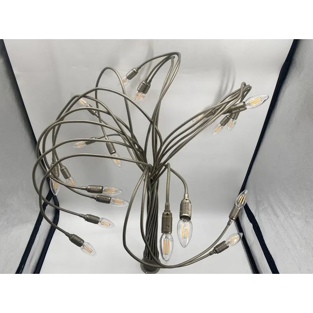 * an extravagant ceiling light * with flexible / movable metal arms * Ceiling holder made of satin metal * Manufacturer:...