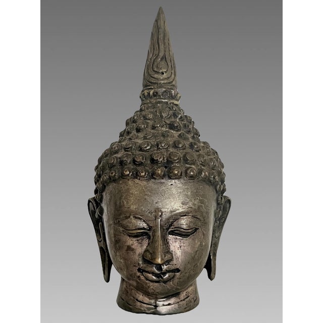 An eye catching image of a Shan style Buddha with its own carved wood stand/plinth. Identified as a depiction of...