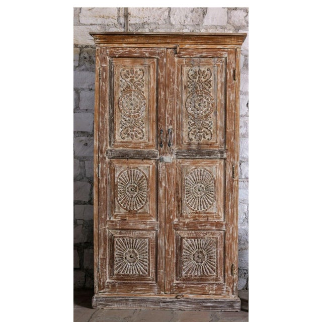 Make a bold design statement with this antique wardrobe armoire, beautifully accented with hand-applied brass studs that...