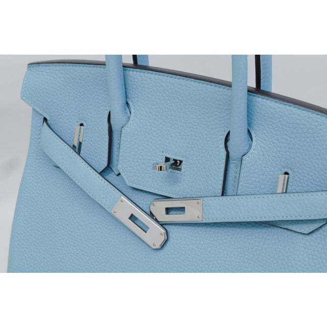 Thirty centimetres is where the Birkin has settled. It is the size the house now sees requested most — wide enough to be...
