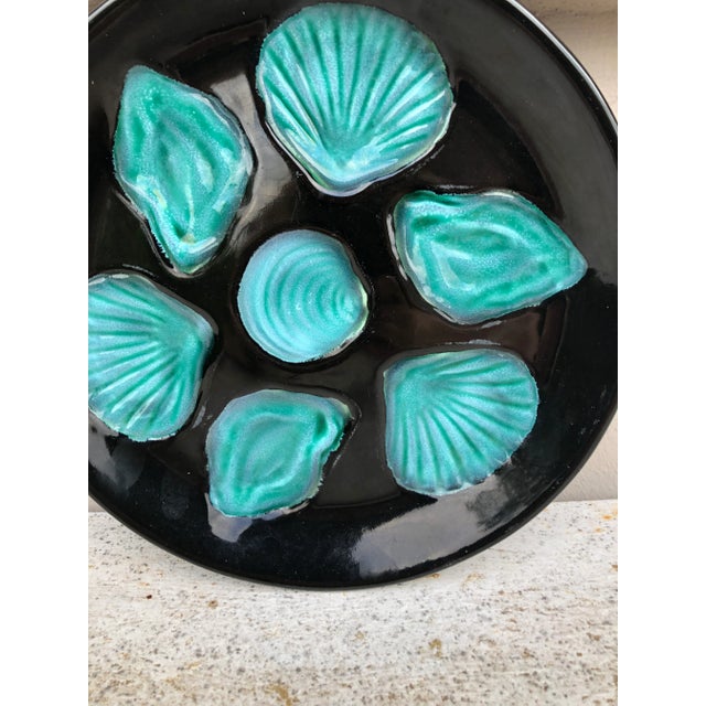 MidCentury French Majolica oyster plate with very vivid colors black and green.