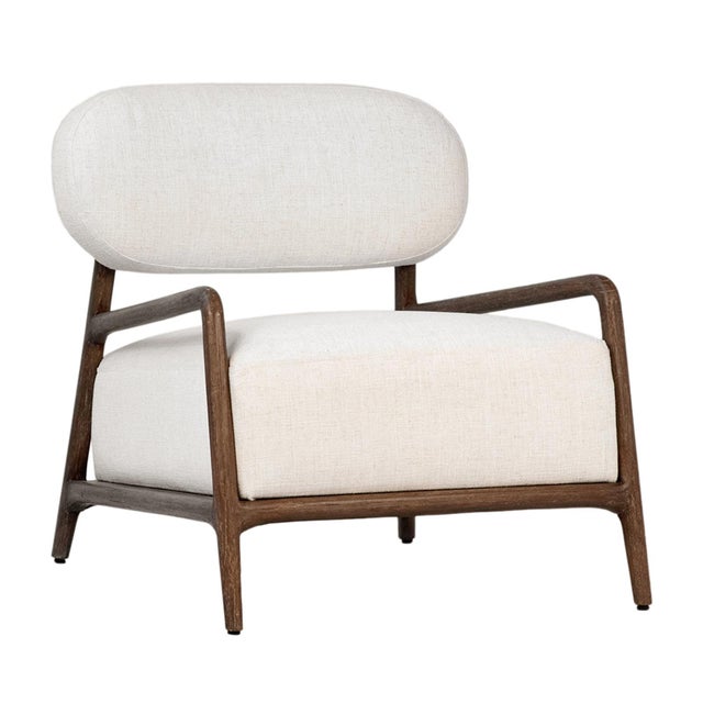 Beautifully crafted accent chair featuring a sculptural solid Mindi wood frame paired with soft linen-blend upholstery in...
