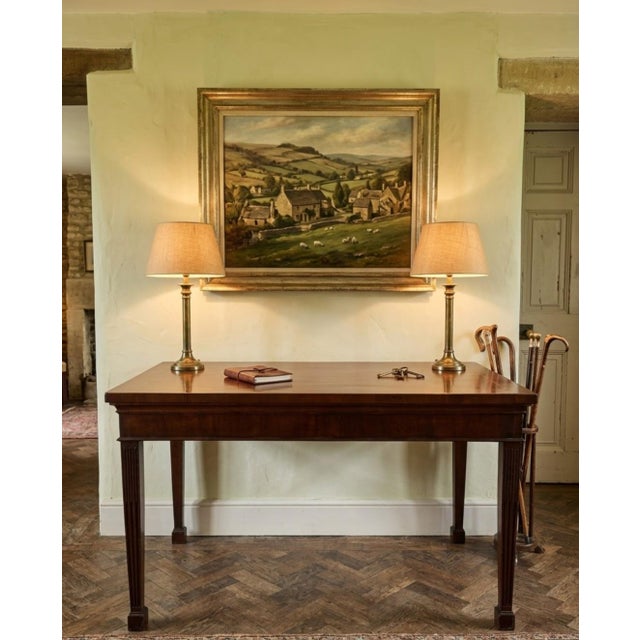 Hutton-Clarke Antiques is pleased to offer this elegant Georgian mahogany serving table/console table, dating from the...