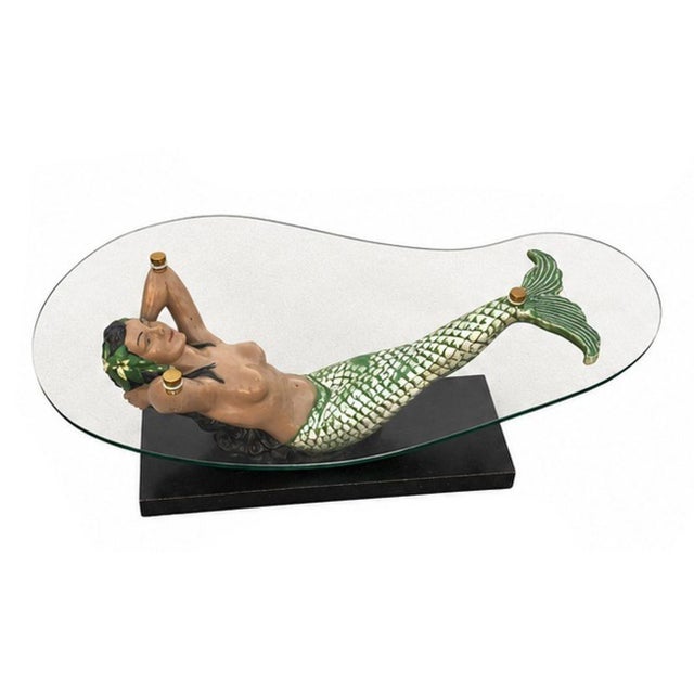 Rare restored nude female mermaid coffee/cocktail table with matching pair of side tables. The coffees featuring an...