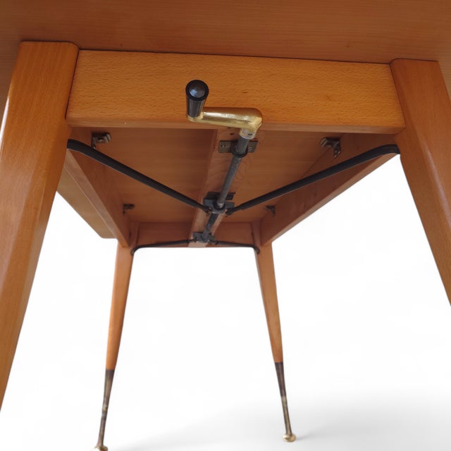 This height-adjustable mid-century coffee table combines timeless design with functional sophistication. Made in Germany...