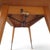 This height-adjustable mid-century coffee table combines timeless design with functional sophistication. Made in Germany...