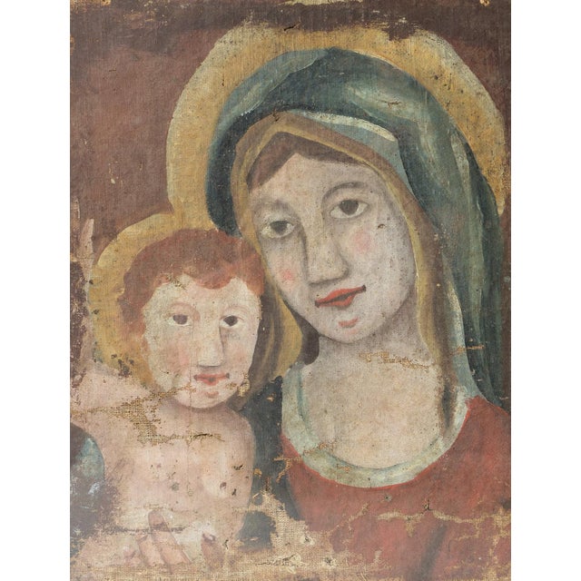 ANTIQUE ORIGINAL OIL ON CANVAS PORTRAIT PAINTING A charming folk art depiction of the Madonna and child. Probably...