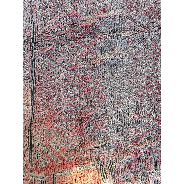 This large Moroccan Boujad rug is an authentic example of traditional Berber craftsmanship from the Haouz and Middle Atlas...