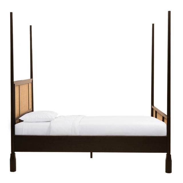 Clean lines and mixed materials make this contemporary bed a standout. This four poster bed features cane weave panels and...