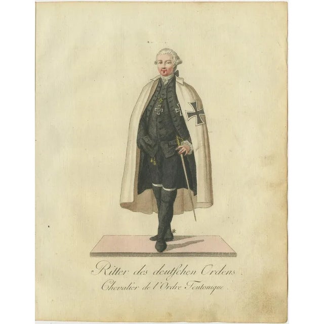 Knight of the Teutonic Order: 1791 Hand-Colored Engraving in Ceremonial Dress This finely detailed hand-colored engraving,...