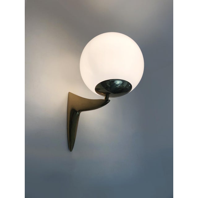 Large pair of designer brass and opaline glass wall sconces from the 1980s Beautiful pair of very stylish brass wall...