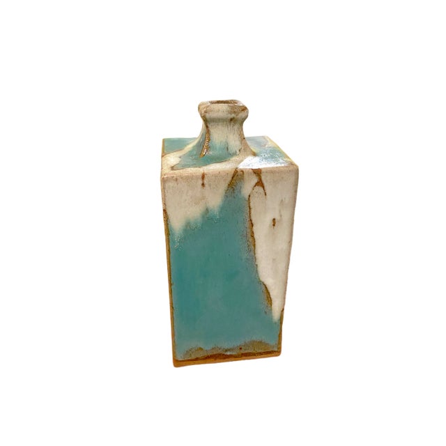 A stunning example of Shoji Hamada’s iconic Mingei craftsmanship, this rectangular bottle vase attributed to the artist...