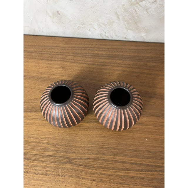 Add character to your home with this stunning set of two handmade pottery vases by Wormser, dating from the mid-century....