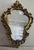 A beautiful Mid-Century giltwood Italian Provincial wall mirror. Excellent condition! This also comes with two beautiful...