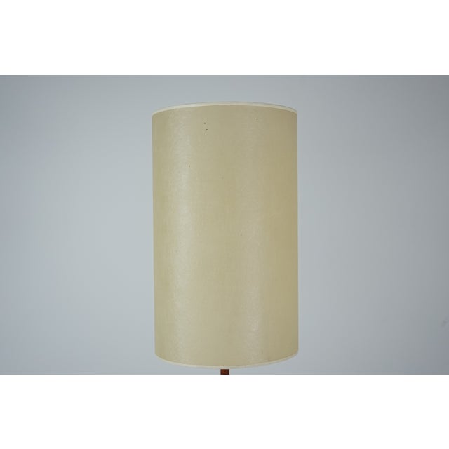 This classic mid-century modern floor lamp combines timeless design with warm materials and functional elegance. Crafted...